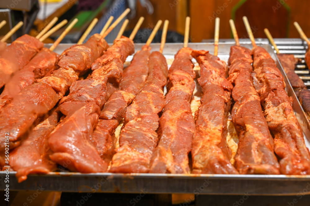 Fresh meat on skewer ready for grilling. Barbecue on fair. Fresh meat on skewer ready for grilling. Barbecue on fair.