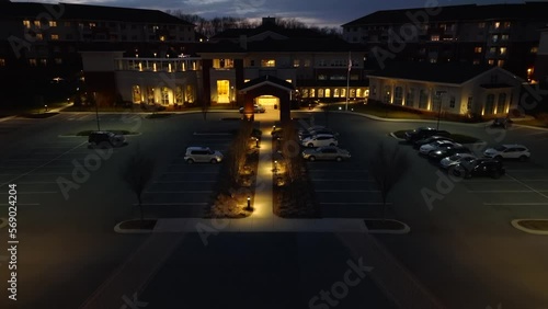 Aerial tilt up reveal of American retirement community at night. photo