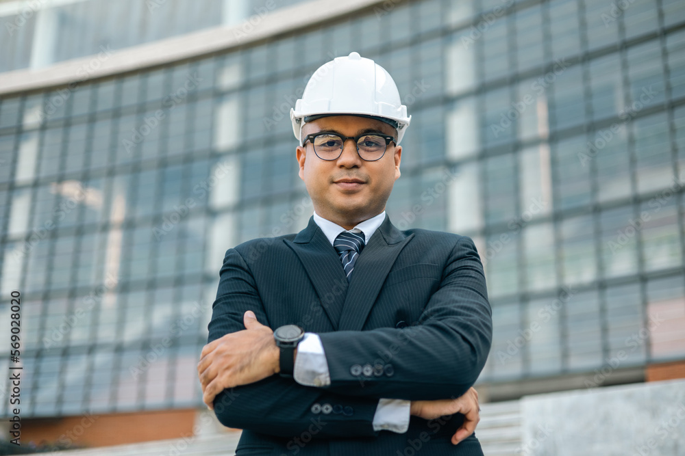 Businessman manager owner real estate at modern office building. Cooperation of architect designer. Engineer with safety helmet checking at working construction site Businessman manager owner real estate at modern office building. Cooperation of architect designer. Engineer with safety helmet checking at working construction site