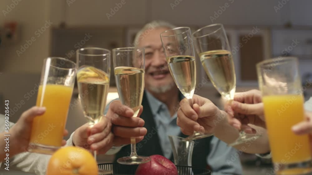 asian senior man proposing a toast to celebrate holiday during family dinner at home asian senior man proposing a toast to celebrate holiday during family dinner at home