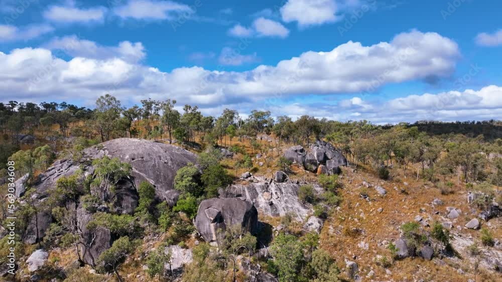 Aerial close up of Slug Rock and sparse bushland Bowen hinterland Australia Aerial close up of Slug Rock and sparse bushland Bowen hinterland Australia