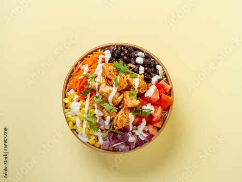 brown rice, cajun chicken, tomato, corn, black beans, carrots, onion, cilantro, and greek yogurt ranch dressing