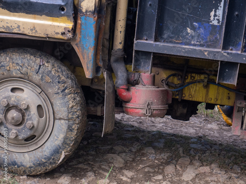 old truck full of earthen mud