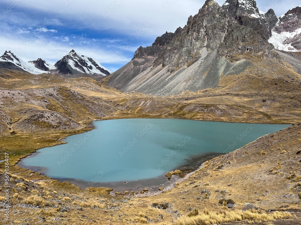 High-mountain lake on the background of a high mountain covered with snow. Peru 