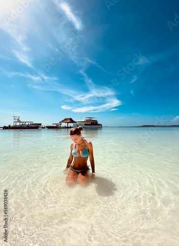 Beautiful girl on the shore of Contoy Island, Mexico 