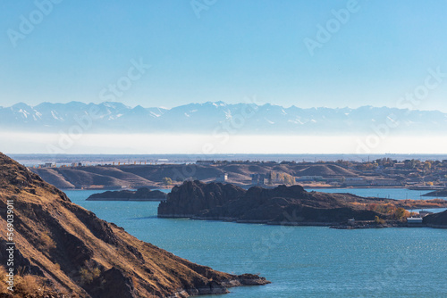 Lake Kapchagai near the city of Konaev against the backdrop of mountains in Kazakhstan, Almaty region. © Roman