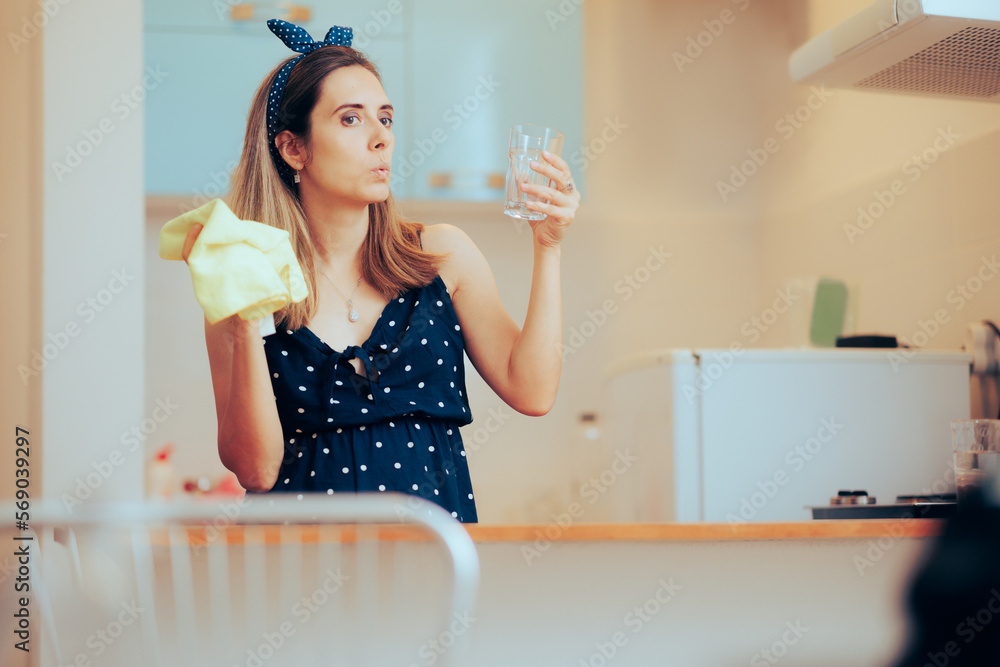 Woman Cleaning a Glass Using a Cloth in her Kitchen. Exigent person washing and drying dishware enjoying domestic chores
Woman Cleaning a Glass Using a Cloth in her Kitchen. Exigent person washing and drying dishware enjoying domestic chores