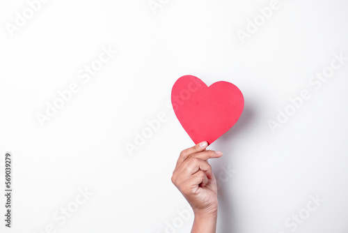 A photo of a red heart shape paper isolated on white background.