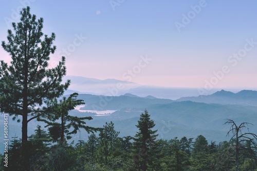 Fototapeta Naklejka Na Ścianę i Meble -  sunrise over the mountains - river and mountain layers with pink and blue clouds