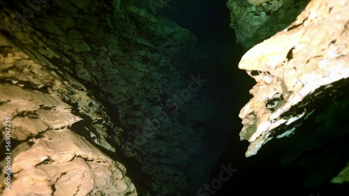 Budapest - 17 August 2017: Technical diver in red flippers in the underwater cave of Budapest photo