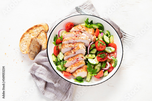 Salad with chicken meat. Fresh vegetable salad with chicken breast. Meat salad with chicken fillet and fresh vegetables on plate.
