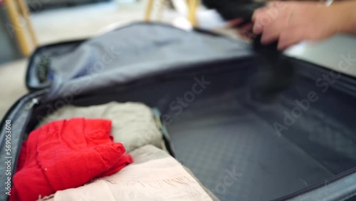 Packing a suitcase, girl packing luggage ready for a trip