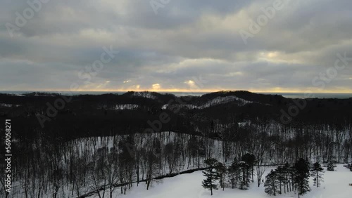 Winter sun peaking through dense cloud cover. photo