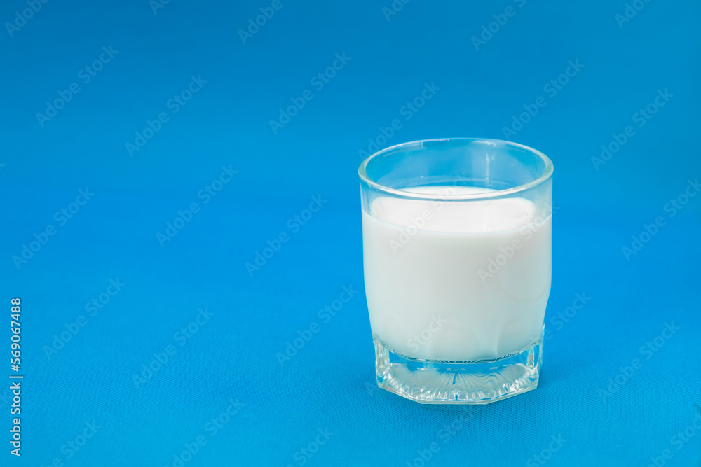 Glass of milk Isolated on a color background. Dairy product close-up. Drink milk for a good health. Cow milk. good product of social. copy space for text. Glass of milk Isolated on a color background. Dairy product close-up. Drink milk for a good health. Cow milk. good product of social. copy space for text.