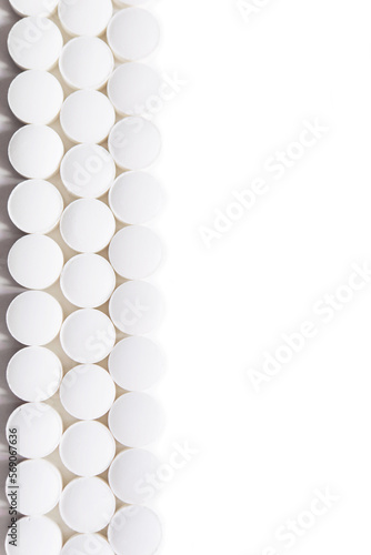 Fototapeta Naklejka Na Ścianę i Meble -  Scattered white pills isolated on white background. Model special offers as advertising, web background or other ideas. concept of medicine, pharmacy and healthcare. Copy space.