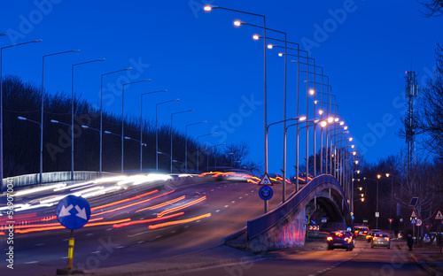 Long exposure traffic in the early morning on a bridge from DN1 national road in Bucharest, Romania. Transportation industry. photo