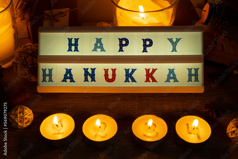 Four Candles with advent calendar Lightbox with text HAPPY HANUKKAH  Traditional Burning Christmas Wax Candles with numbers counting down for  Christmas. Beautiful Advent At Home. Festive Candlelight Stock Photo |  Adobe Stock