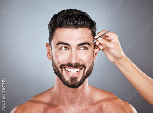 Face, salon and man with tweezers in studio isolated on a gray background for wellness. Thinking, hair removal and male model with facial product to pluck eyebrows for grooming and beauty with barber
