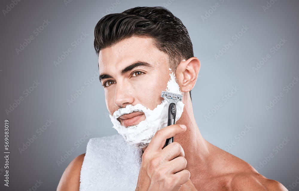 Face, shaving cream and man with razor in studio isolated on a gray background. Skincare, cleaning and thinking male model with facial product, foam or gel to shave for wellness, health and hygiene. Face, shaving cream and man with razor in studio isolated on a gray background. Skincare, cleaning and thinking male model with facial product, foam or gel to shave for wellness, health and hygiene.