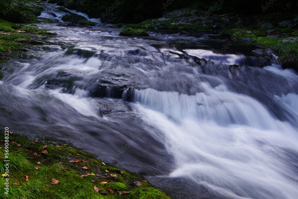 Landscape photo of steep waterfall in mountain stream Landscape photo of steep waterfall in mountain stream