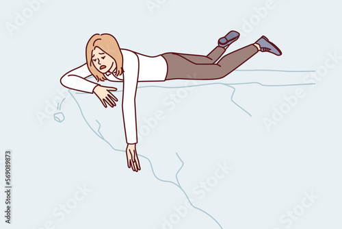 Weakened woman lies on edge of cliff stretching hand down. Girl in business clothes on edge of mountain symbolizes risk when trying to save person experiencing problems at work