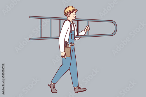 Man professional repairman in overalls carries stepladder on shoulder heading to place of work. Builder guy in protective helmet with repair tools on belt holds ladder