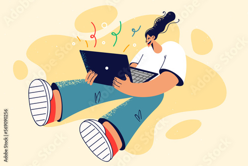 Smiling woman celebrate win on laptop 