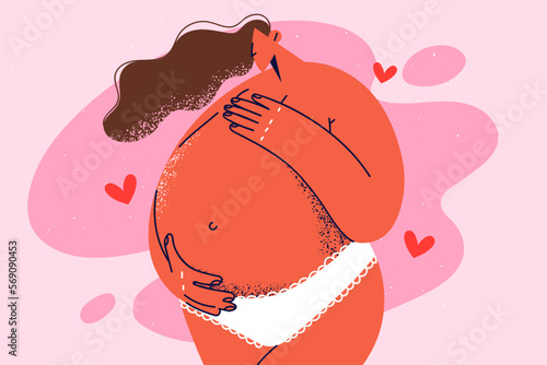 Pregnant woman touching big belly 