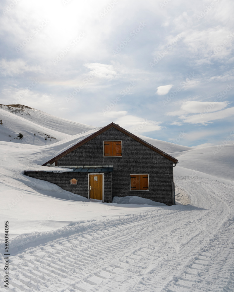 Mountain cabin covered with snow Mountain cabin covered with snow