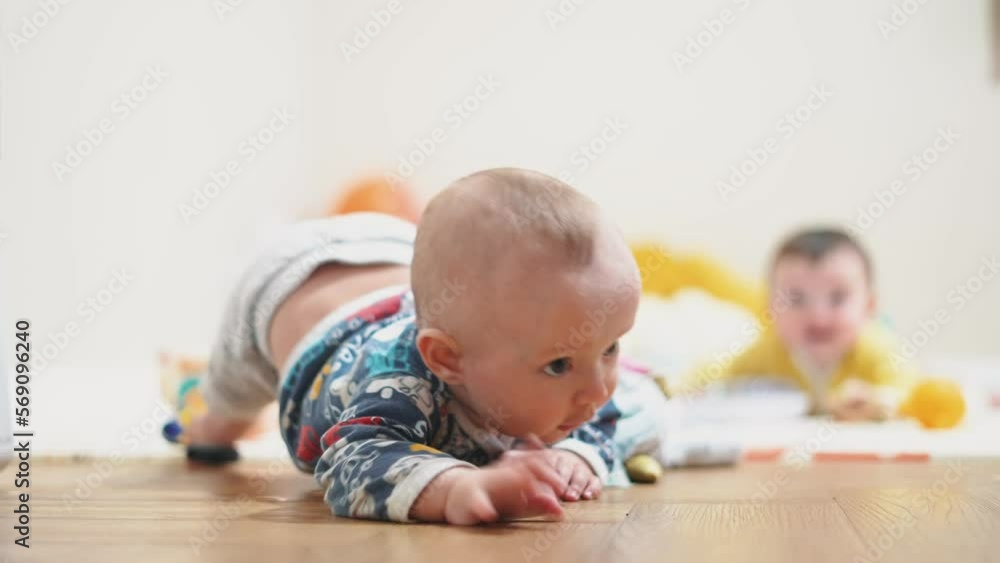 baby newborn a portrait. kid in kindergarten playing on the floor many toys indoors. happy family baby dream concept. little infant baby portrait in kindergarten. lifestyle happy childhood baby newborn a portrait. kid in kindergarten playing on the floor many toys indoors. happy family baby dream concept. little infant baby portrait in kindergarten. lifestyle happy childhood