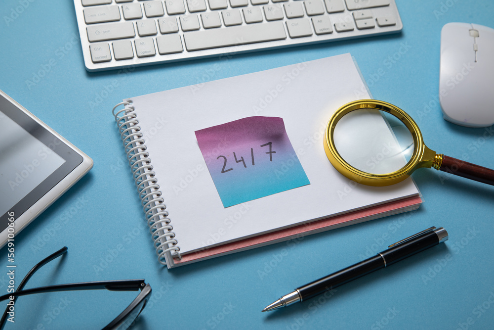 24/7 on sticky note with a computer keyboard. 24/7 on sticky note with a computer keyboard.