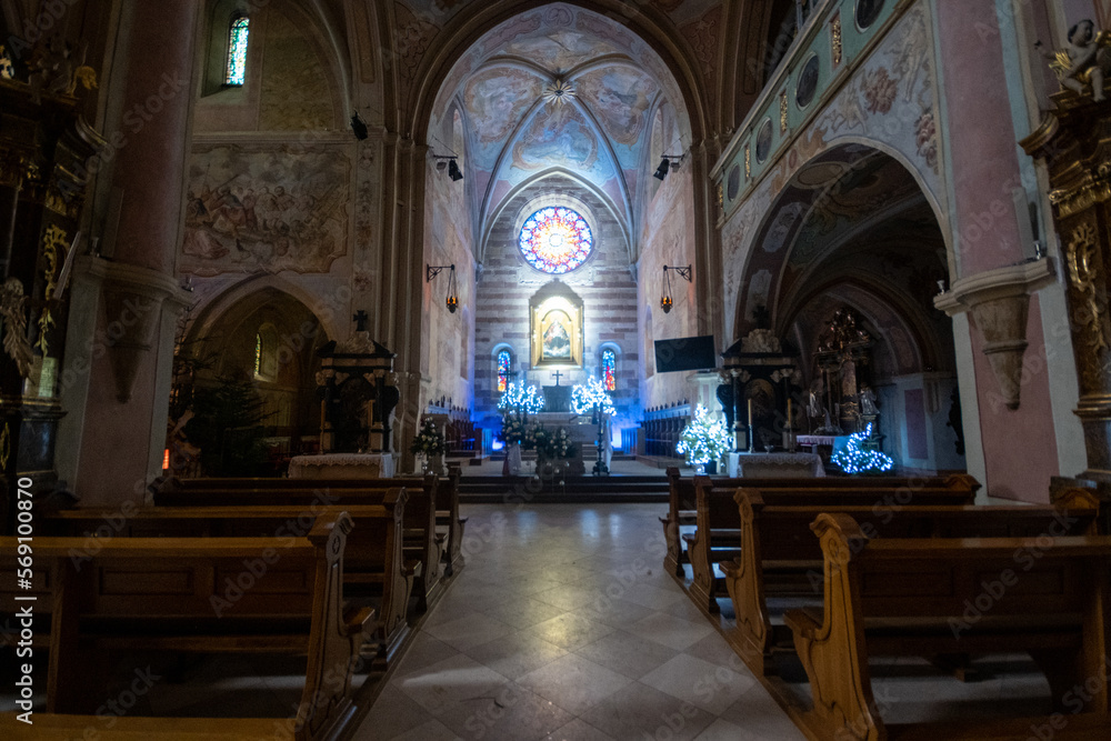 Fototapeta premium Altar and benches in an old 12th-century church in Poland