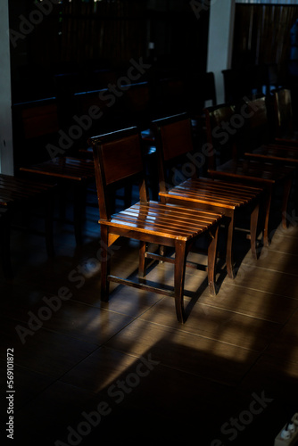 chair in dark room with spot light photo