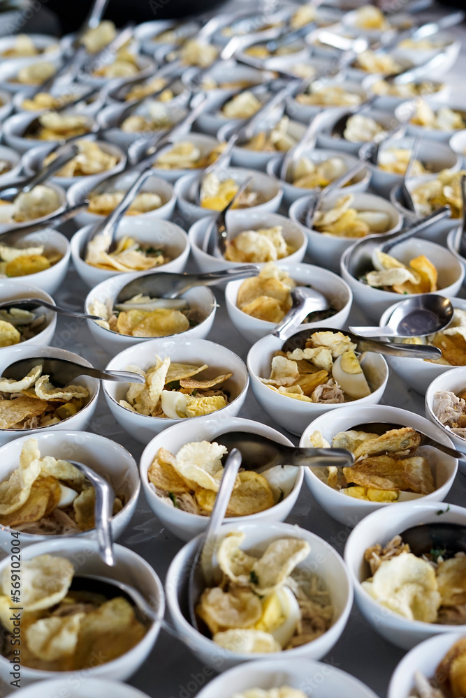 soto ayam is authentic indonesian food. lined up on the dining table ready to be served soto ayam is authentic indonesian food. lined up on the dining table ready to be served