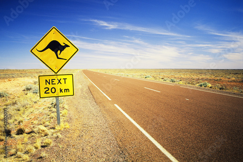 Australian desert highway with a kangaroo sign