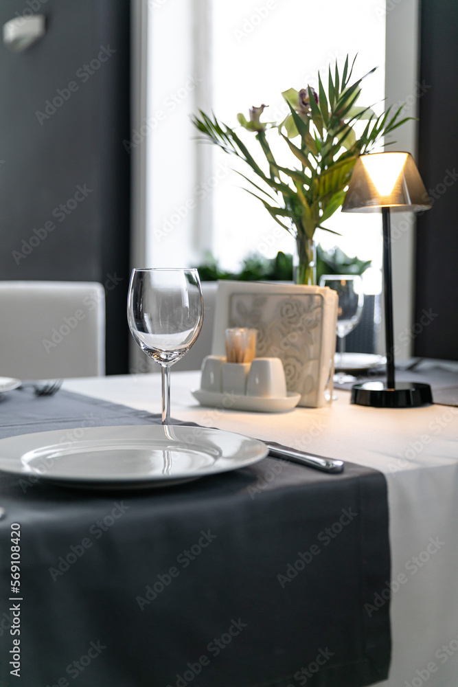 a set table in a restaurant
a set table in a restaurant
