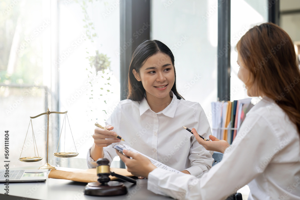 Lawyer Legal counsel presents to the client a signed contract with gavel and legal law. justice and lawyer Business partnership meeting concept Lawyer Legal counsel presents to the client a signed contract with gavel and legal law. justice and lawyer Business partnership meeting concept