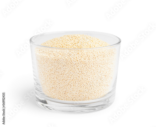 Glass bowl of amaranth seeds isolated on white background
