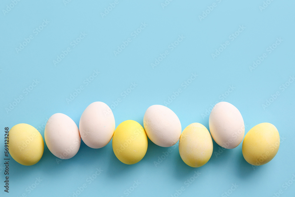 Row of painted and natural Easter eggs on color background Row of painted and natural Easter eggs on color background