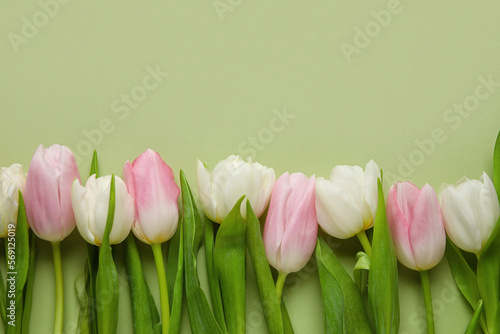 Beautiful tulip flowers on green background, closeup. Hello spring