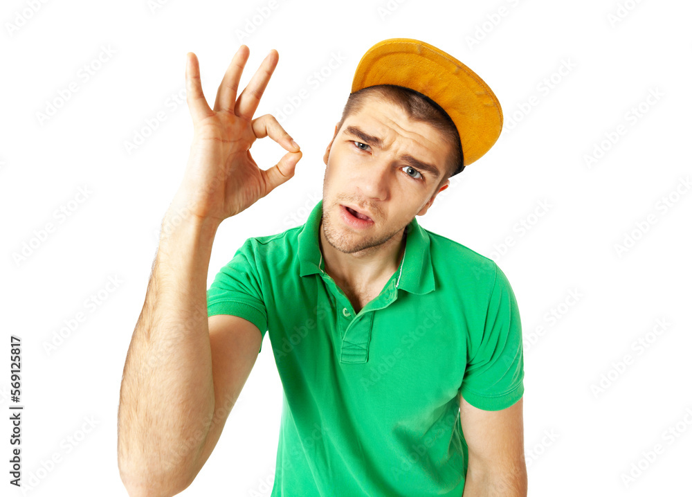 Cool looking young guy showing OK sign standing against white background. Cool looking young guy showing OK sign standing against white background.