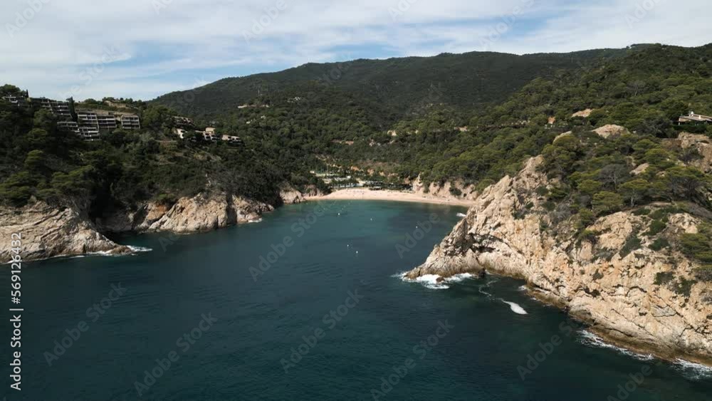 Wide Sliding Drone Shot of Spanish Beach in Giverola, Costa Brava Wide Sliding Drone Shot of Spanish Beach in Giverola, Costa Brava