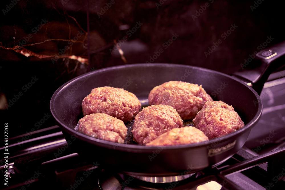 meat cutlets are fried in a frying pan in the kitchen meat cutlets are fried in a frying pan in the kitchen