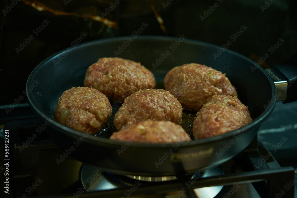 meat cutlets are fried in a frying pan in the kitchen meat cutlets are fried in a frying pan in the kitchen