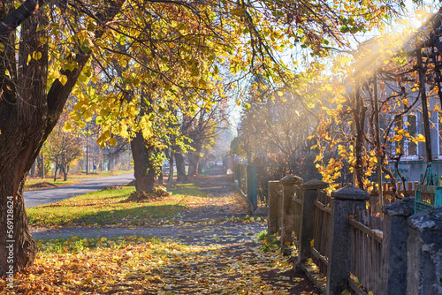 Street in an old town in Eastern Europe on a sunny autumn day photo