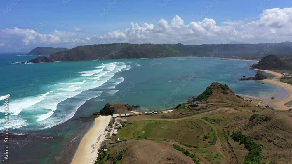 Aerial Panning Scenic View Of Beach On Sunny Day Against Cloudy Sky - Lombok, Indonesia Aerial Panning Scenic View Of Beach On Sunny Day Against Cloudy Sky - Lombok, Indonesia