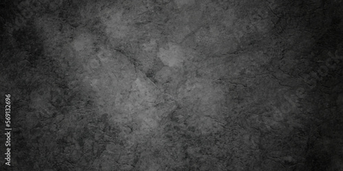 Dark black stone wall grunge backdrop texture background. monochrome slate grunge concrete wall black backdrop vintage marbled textured border background. 