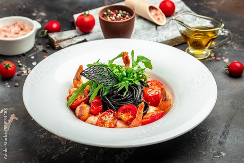 black pasta with shrimp and cherry tomatoes. Delicious balanced food concept, banner, menu, recipe place for text, top view