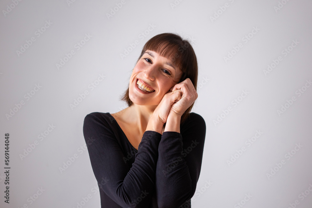 Portrait of a girl on white background. Brown short hair girl. Happy girl with her hands on her face, like you're doing cuteness Portrait of a girl on white background. Brown short hair girl. Happy girl with her hands on her face, like you're doing cuteness