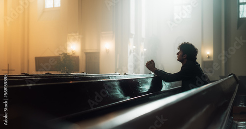 In A Grand Old Church, A Devout Christian Sits, finding Comfort in Faith. Contemplating Life, Seeking Moral Guidance. Sacred Space is Filled With Religious Atmosphere, Providing Solace To The Faithful